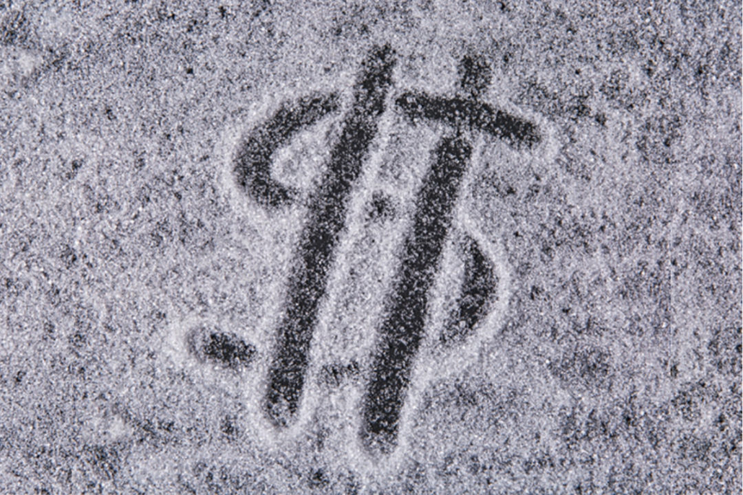 Dollar sign drawn in sugar
