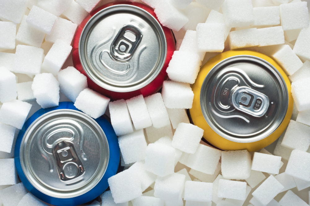 Soda cans in sugar