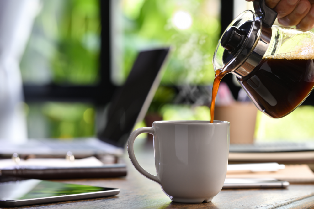 Brewed coffee being poured into a cup