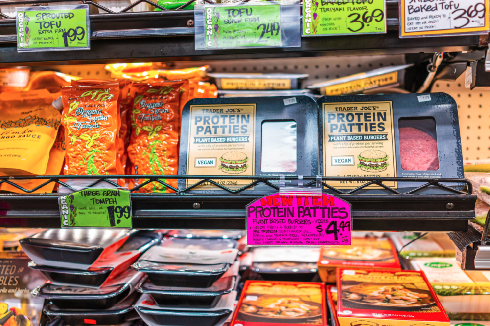 Shopping store with vegan protein patties of plant-based burgers sold inside indoors of Trader Joe's shop