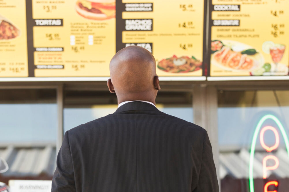 Man reading calories on menu