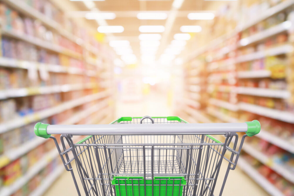 Grocery cart in a supermarket aisle