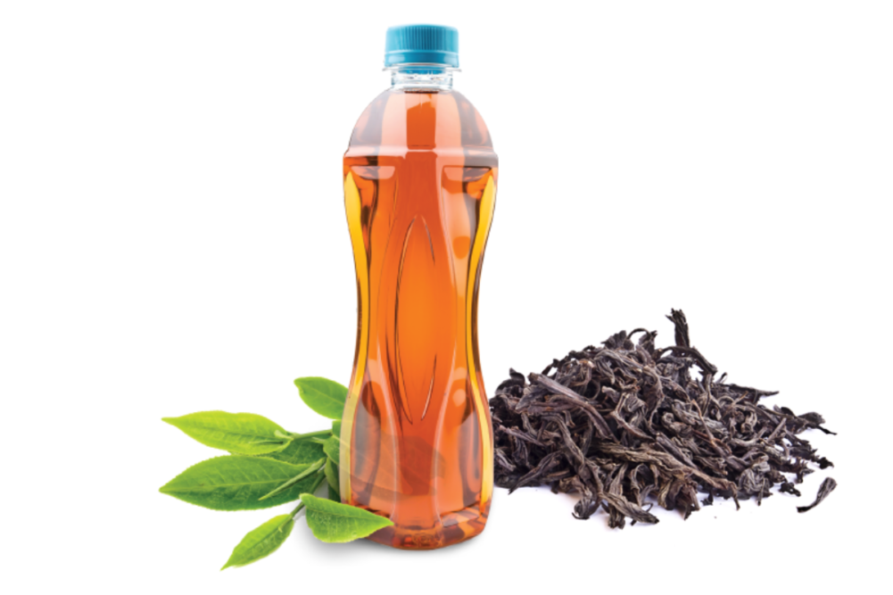 Tea bottle next to tea leaf and dried tea extract