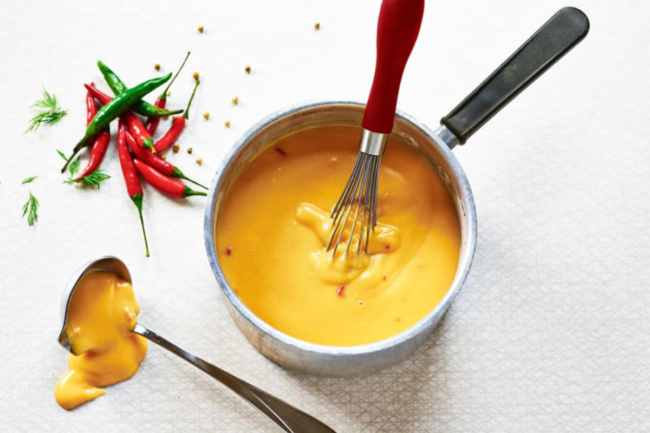 Spicy cheese sauce with peppers