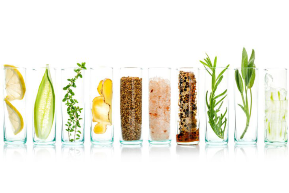 Clear glasses filled with plant-based clean label ingredients