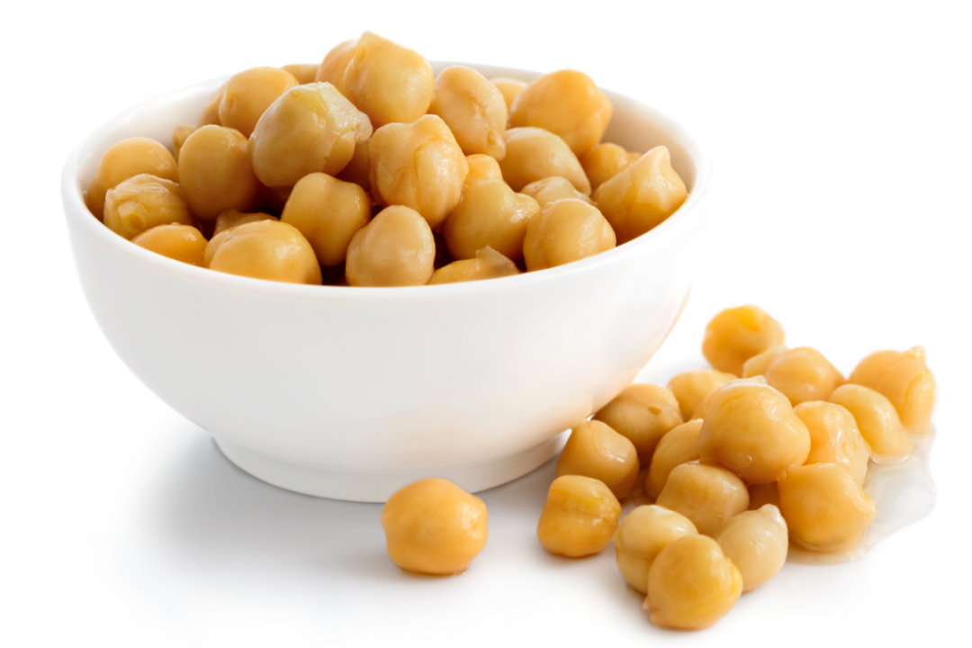 Cooked chickpeas in white bowl on white