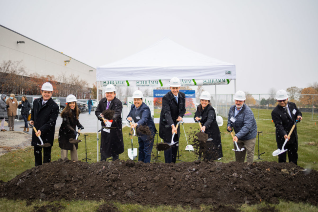 Executives from FONA International breaking ground on site of new facility