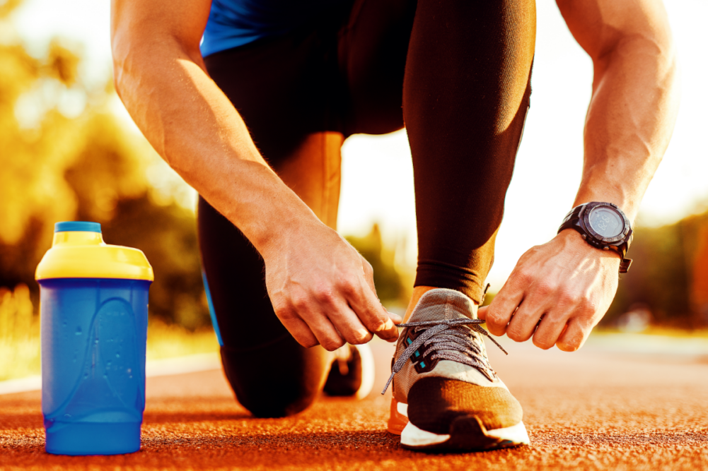 Man tying jogging shoes