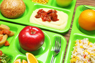 Serving trays with delicious food, closeup. Concept of school lunch