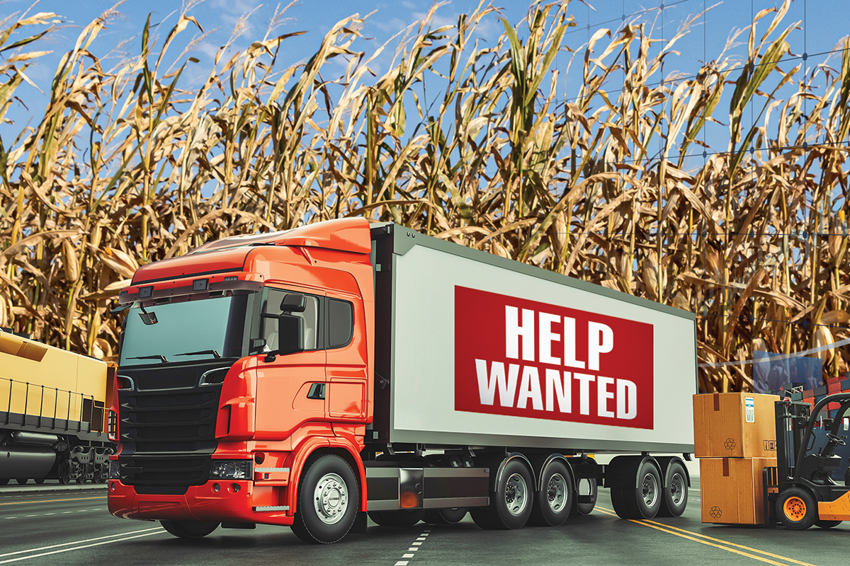 Help wanted sign on truck in wheat field