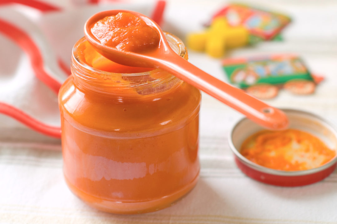 Jar of orange baby food