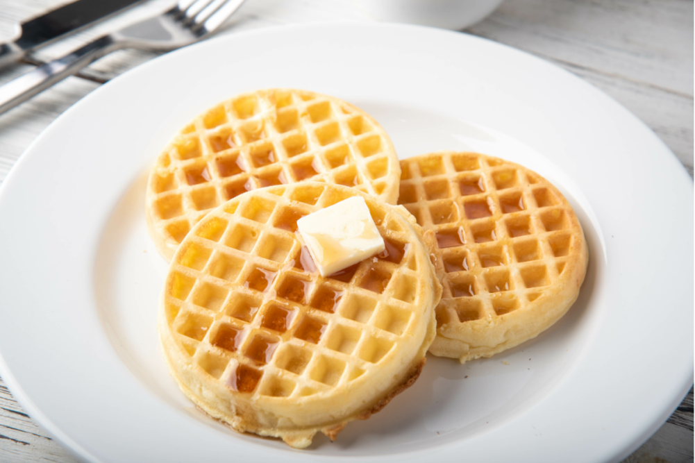 waffles with butter on white plate