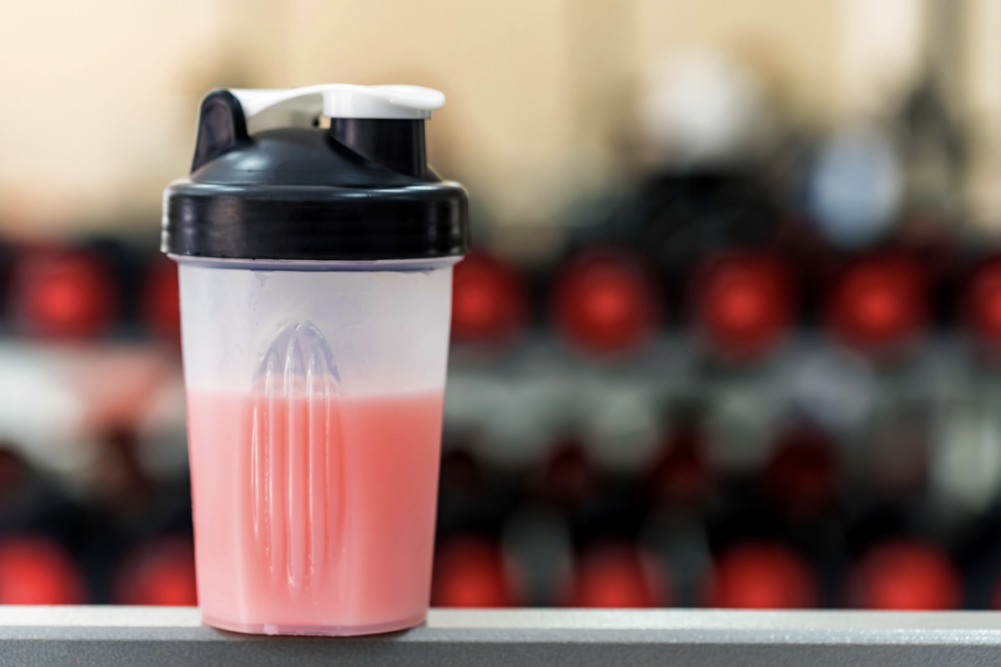 Protein beverage next to exercise equipment