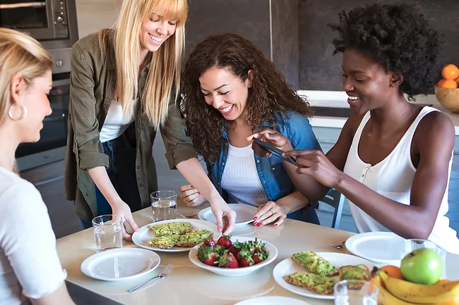 Four friends eating healthy food