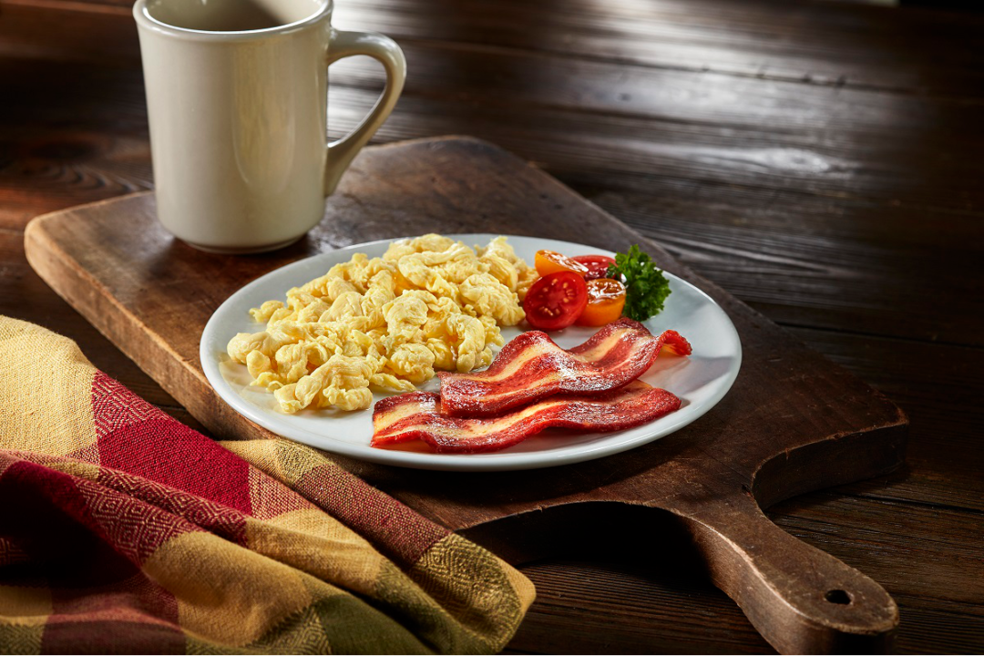 Plant-based bacon on breakfast plate