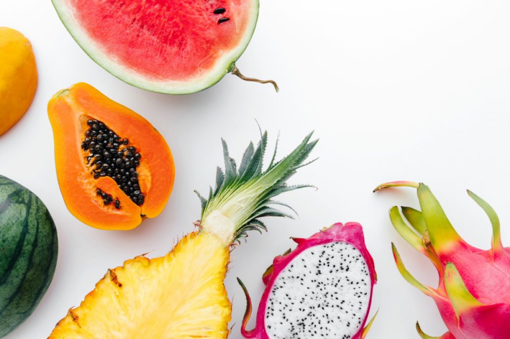 Variety of tropical fruits on white background