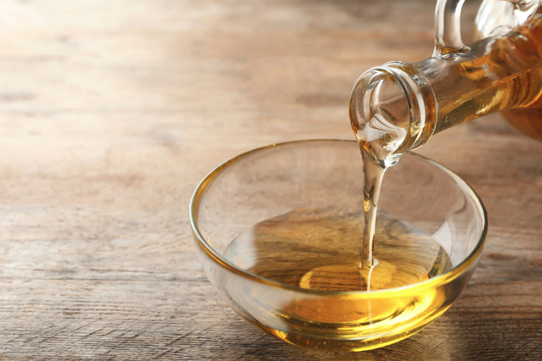Soybean oil pouring into a bowl