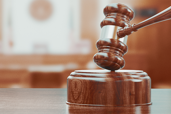 Wooden gavel on table close up