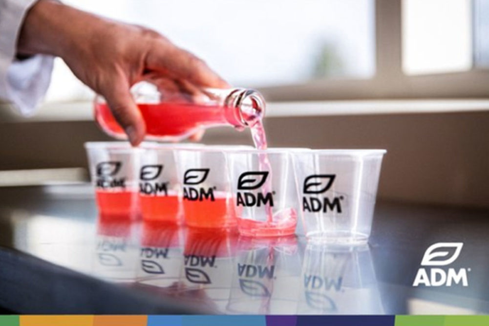 ADM flavors being poured into a cup