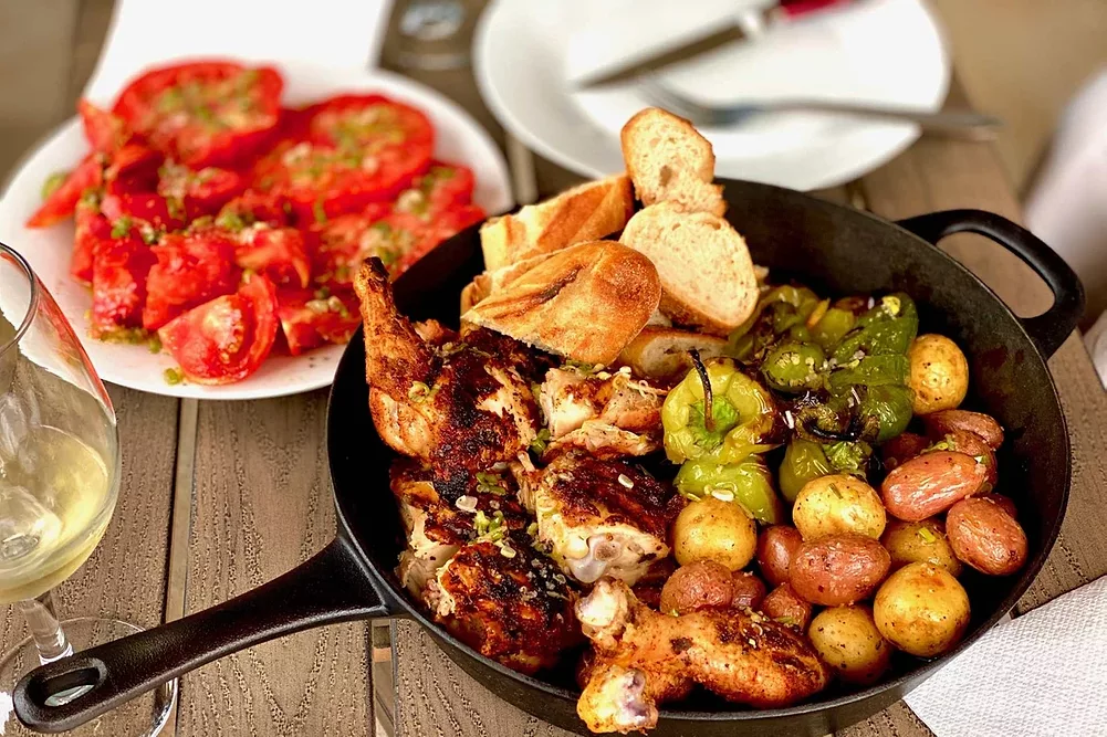 Chicken in skillet with potatoes