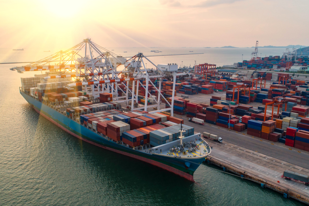 Shipping containers being unloaded from ship