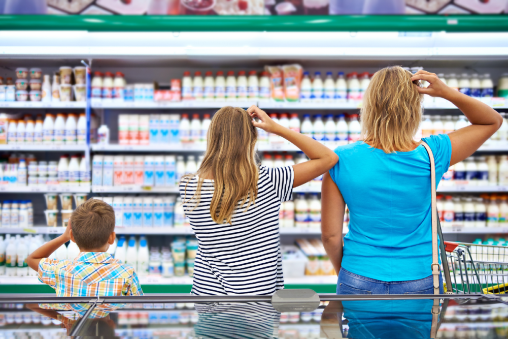 Family looking quizzically at the dairy aisle