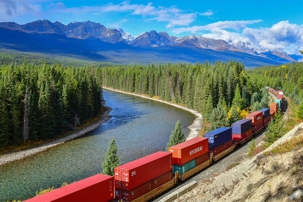 Train in front of Canadian Rockies