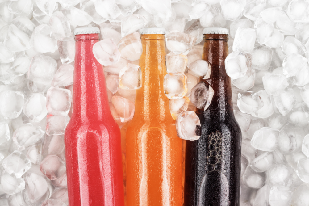 Variety of bottled beverages on ice