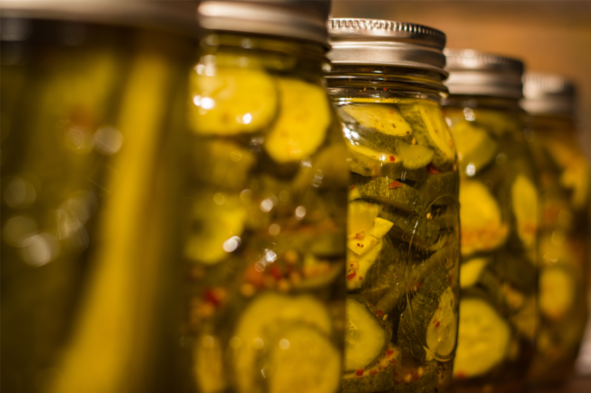 Jars of pickles on a shelf