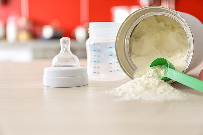 Baby formula on a kitchen table