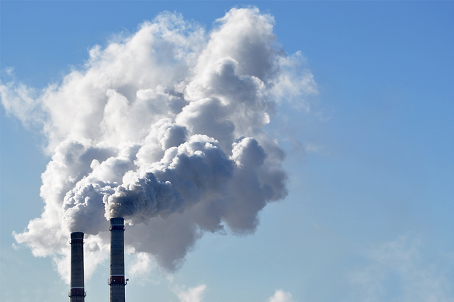 Industrial chimney spewing smoke