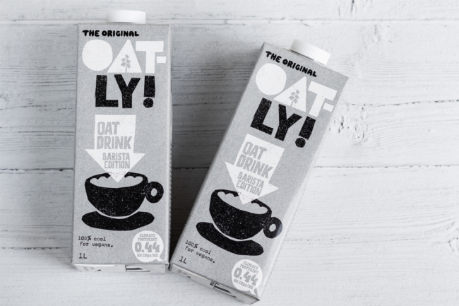 Oatly cartons on a wooden table