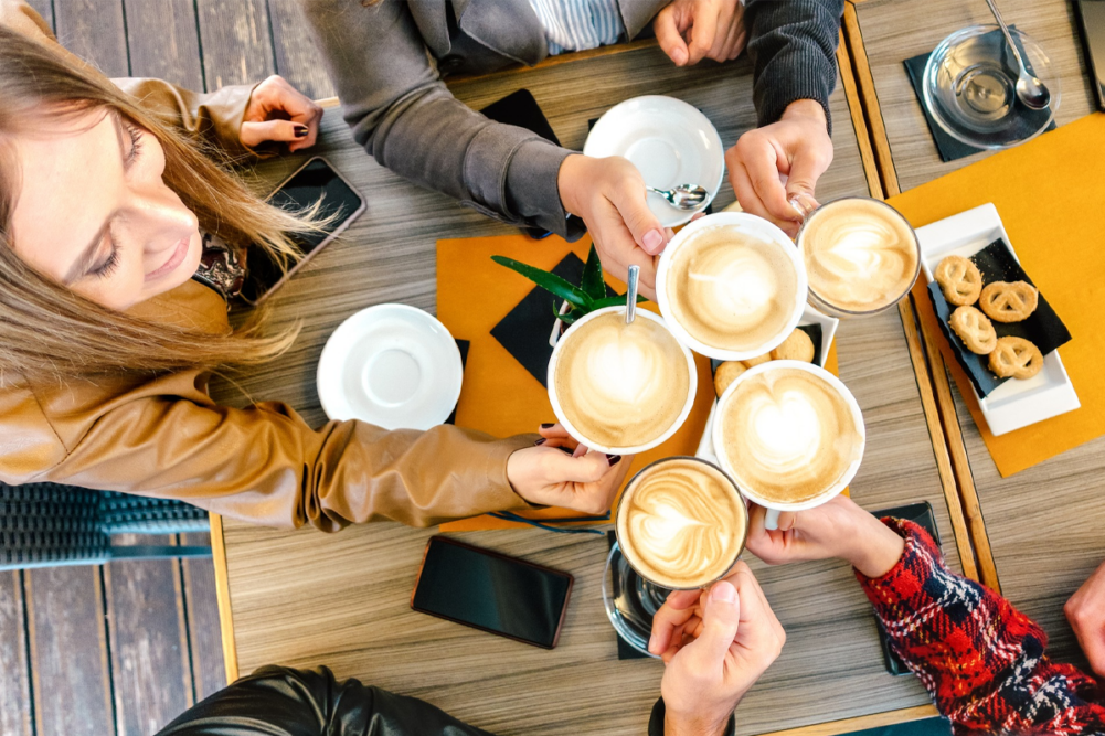 People drinking Fresh Brew around a table