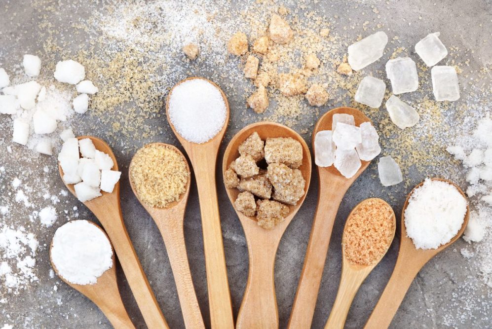 Different kinds of sugar in spoons