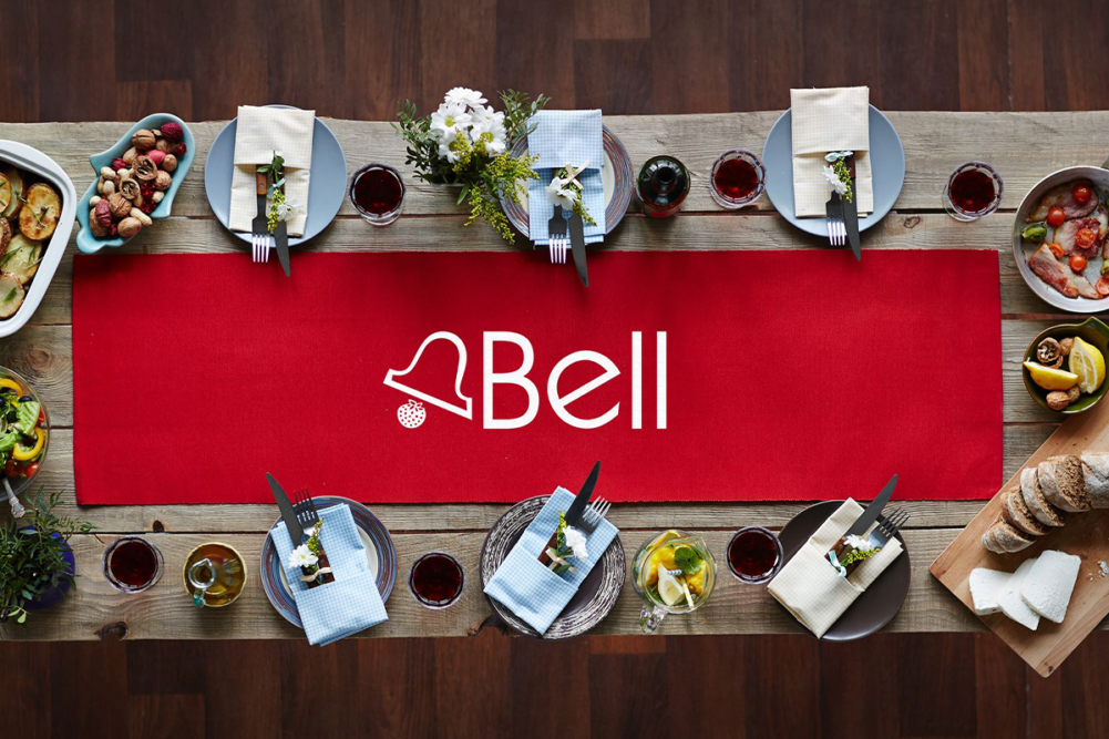 Set table with Bell logo on it