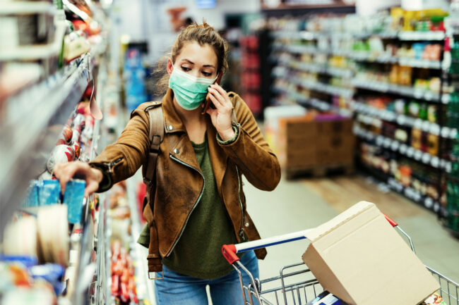 Woman inspecting labels at grocery store