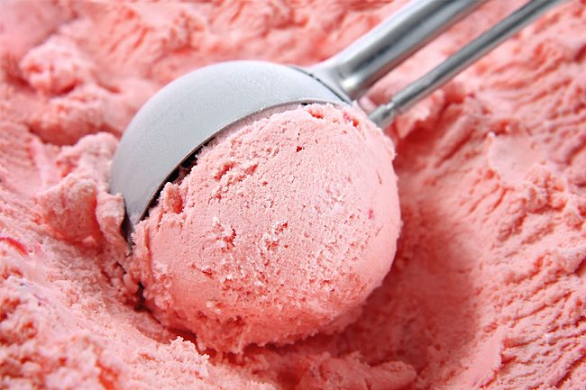 Strawberry being scooped