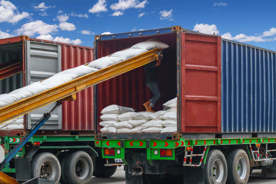 Sugar being loaded onto a semi-truck