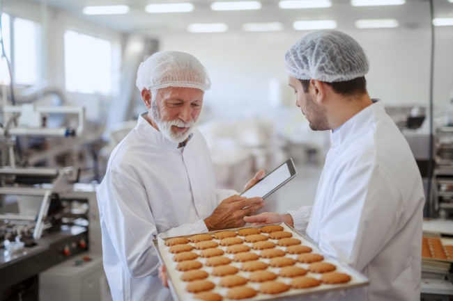 Bakers in an industrial plant