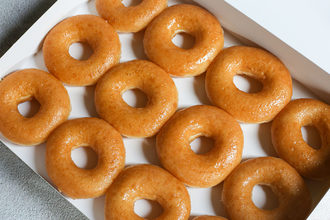A dozen glazed donuts from Krispy Kreme