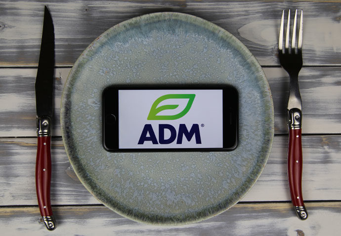 ADM logo on a smartphone on a plate