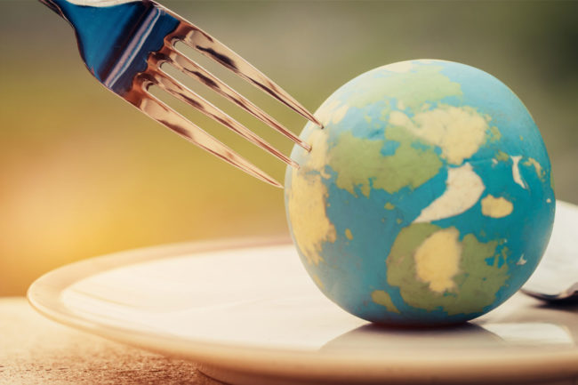 Fork poking a globe