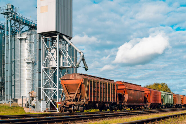 Railway car next to corn elevator