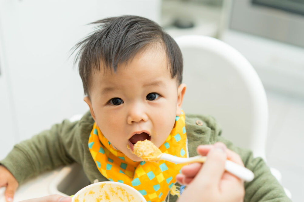 Baby eating baby food