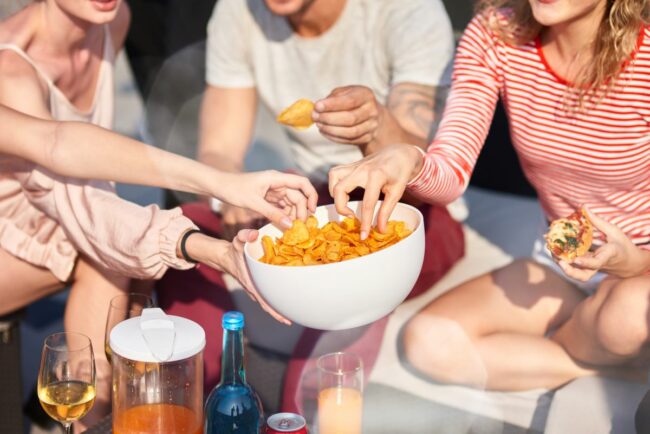 A group of people snacking