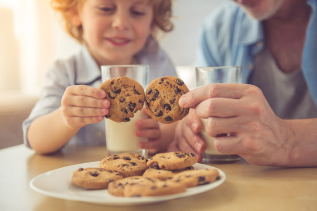Kid with cookies and milk