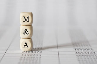 A wooden M and a wooden A for mergers and acquisitions