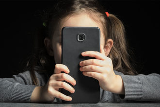 Small child with a big smartphone