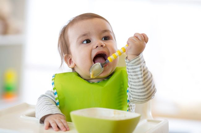 Baby eating baby food