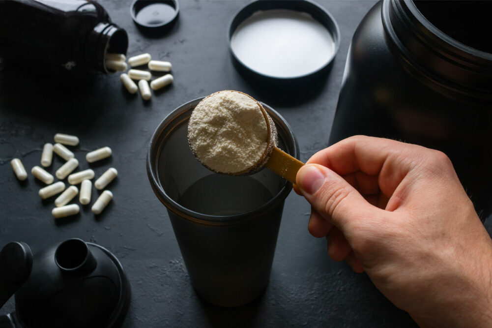 Person making a protein shake